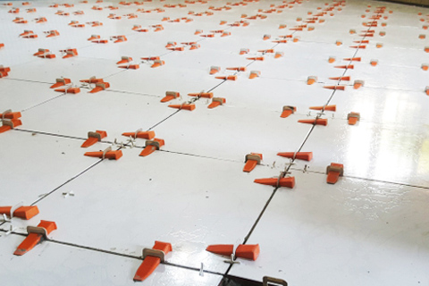 Implementing a tile leveling system