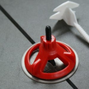 Implementing a screw tile leveling system